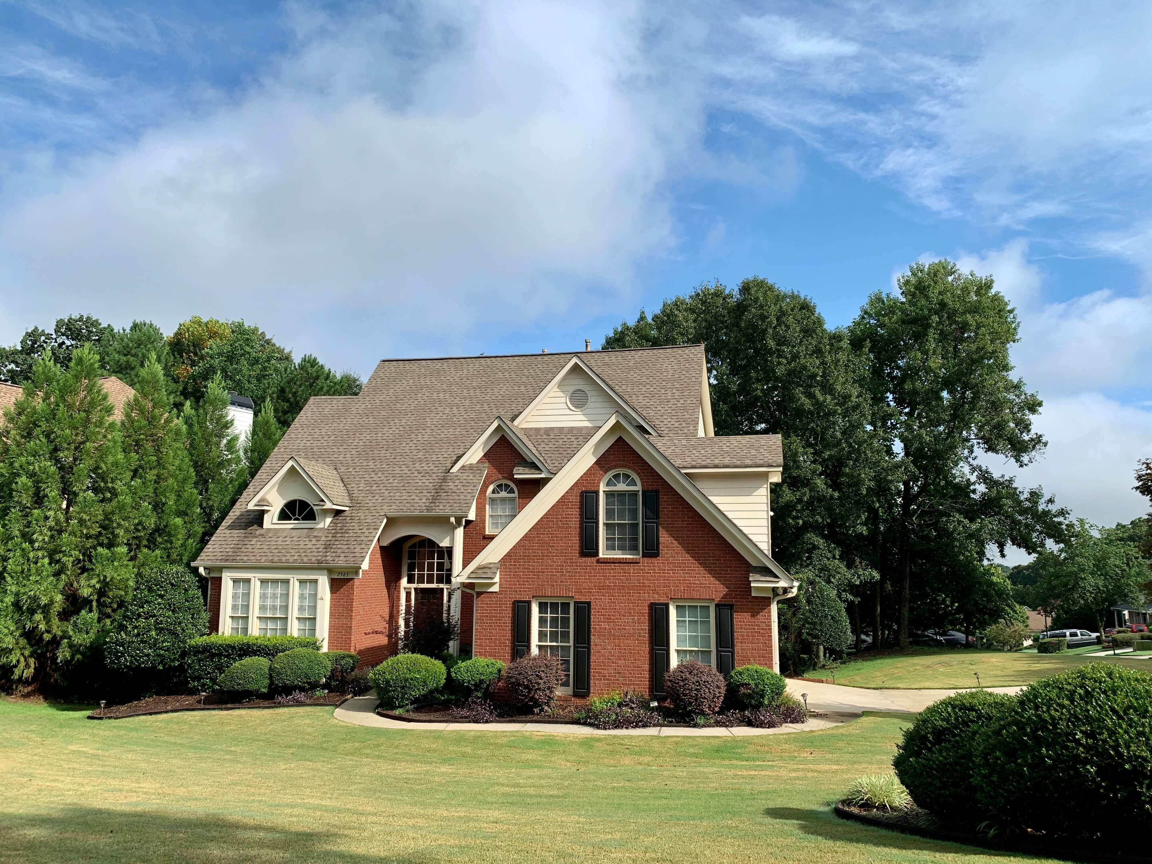 Beautiful Virginia colonial home with brick facade, manicured landscaping, and classic Mid-Atlantic architecture — typical of Northern Virginia, Richmond suburbs, and Virginia Beach neighborhoods